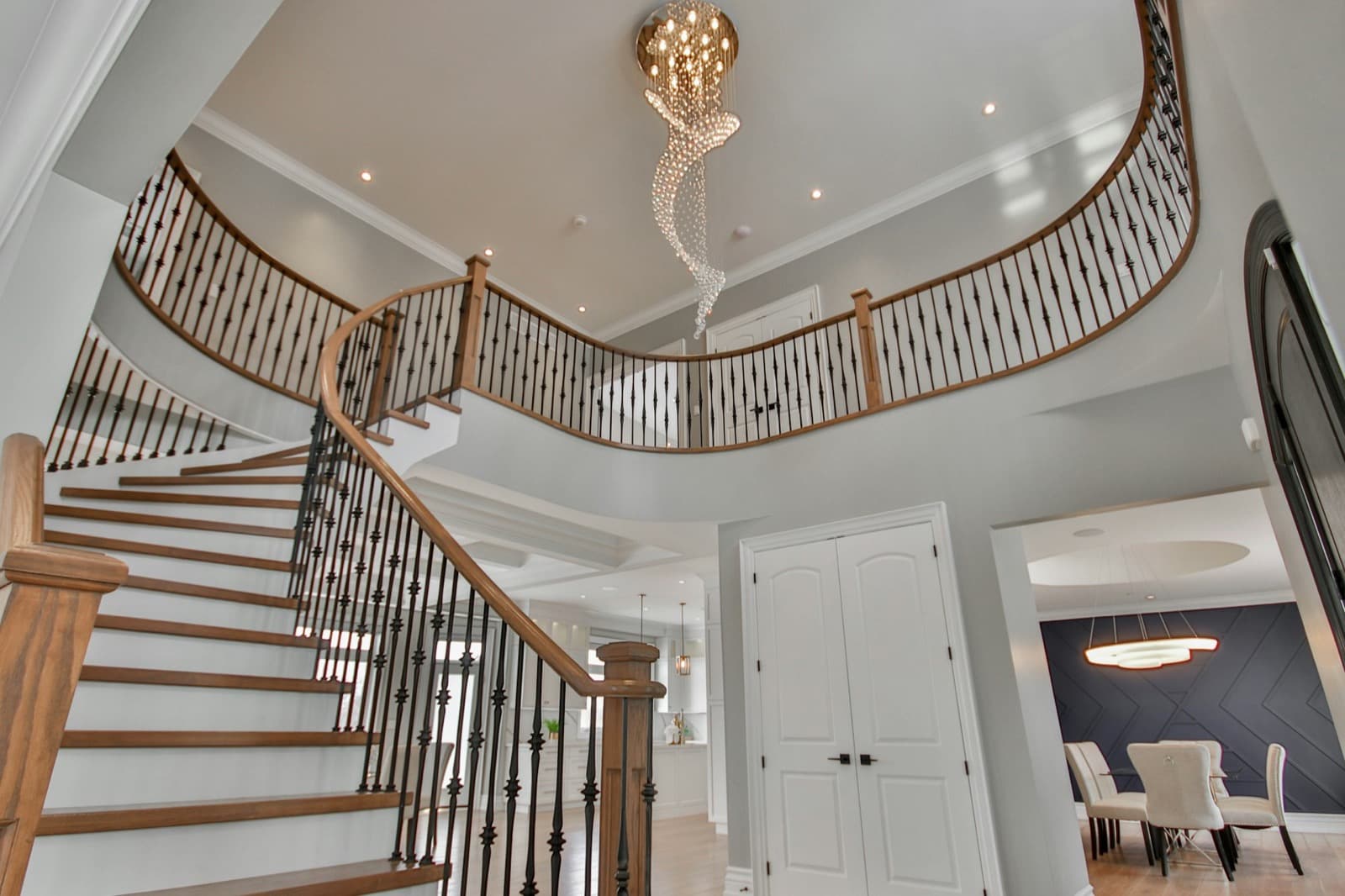 Luxury home interior with classic chandelier and stairwell — characteristic of Great Neck estate restorations
