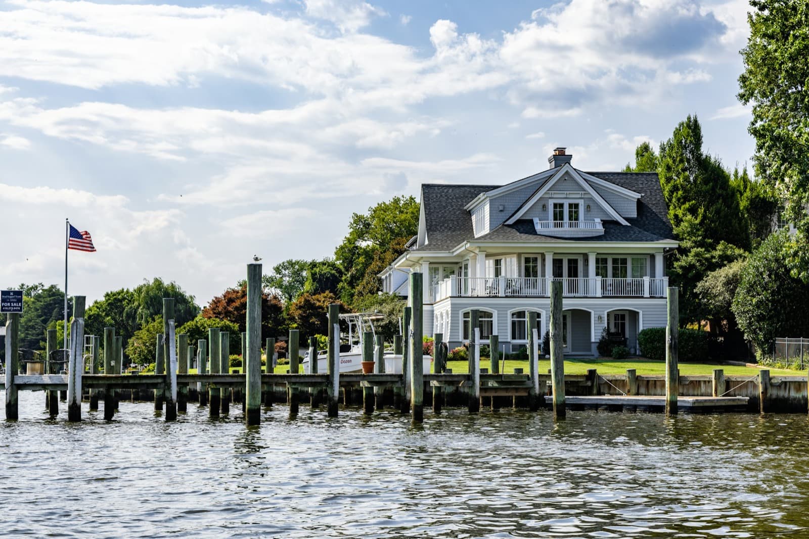 Waterfront estate home with private dock — characteristic of Roslyn Harbor whole-house renovation projects