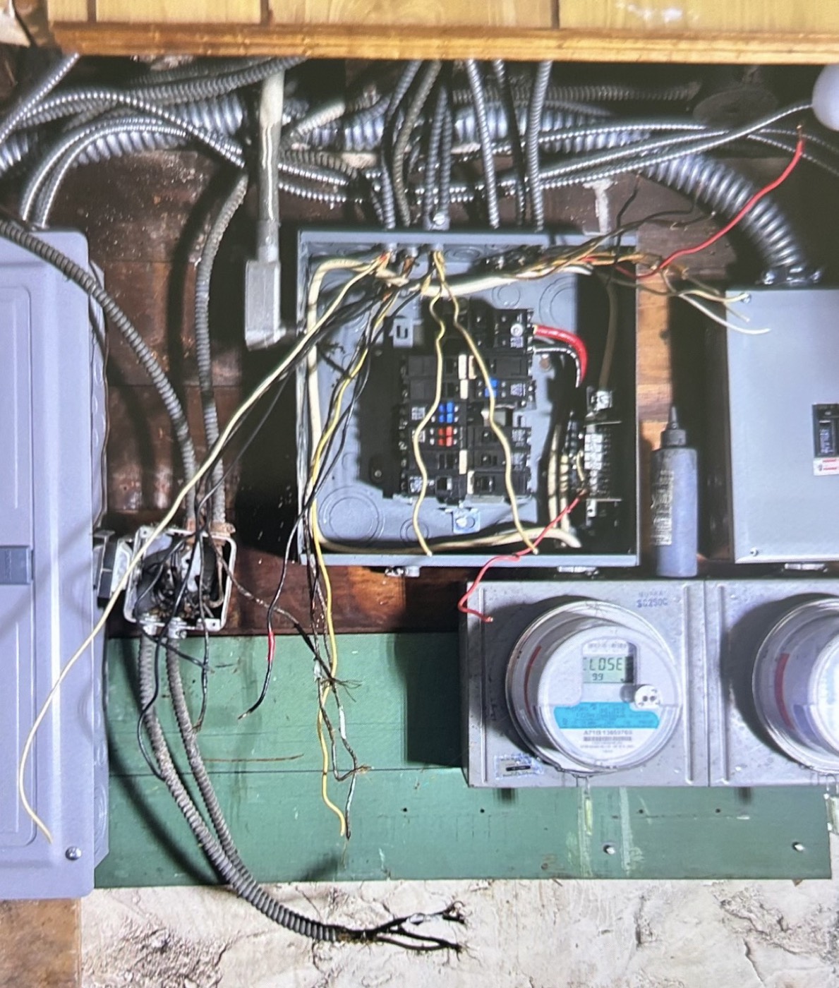 Before — original electrical panel in an older Locust Valley home